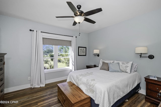 bedroom featuring ceiling fan and dark wood-type flooring