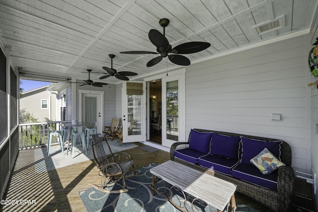 exterior space with outdoor lounge area and french doors