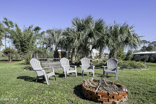 view of yard with an outdoor fire pit