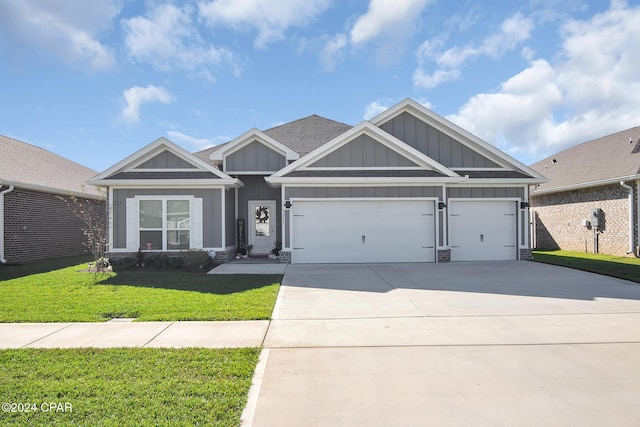 craftsman-style home featuring a garage and a front lawn