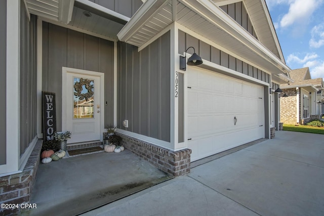 view of exterior entry featuring a garage