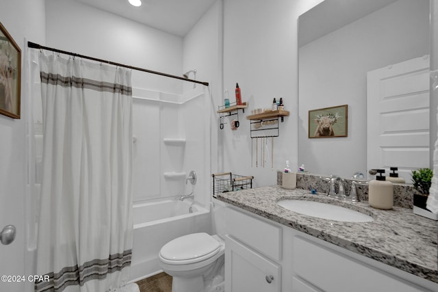 full bathroom featuring vanity, shower / bath combo, and toilet