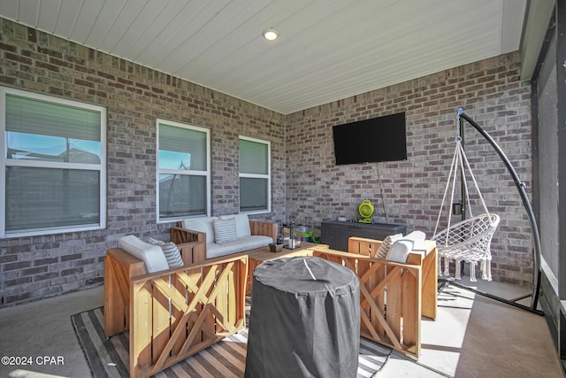 view of patio with a grill and an outdoor hangout area