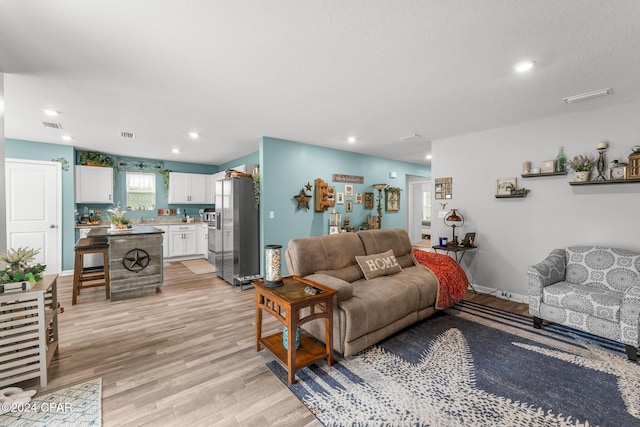 living room with light hardwood / wood-style flooring