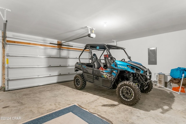 garage featuring electric panel and a garage door opener