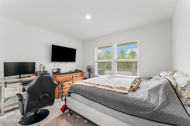 bedroom featuring light colored carpet