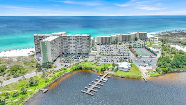 drone / aerial view featuring a water view and a view of the beach