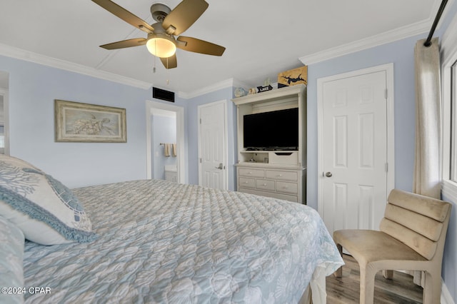 bedroom with hardwood / wood-style flooring, ceiling fan, and ornamental molding