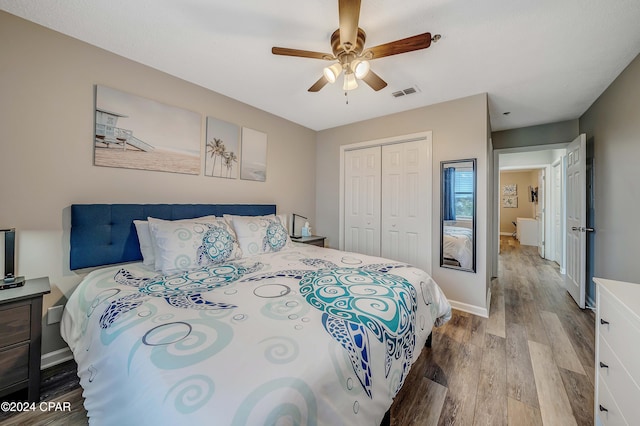 bedroom with a closet, ceiling fan, and hardwood / wood-style flooring