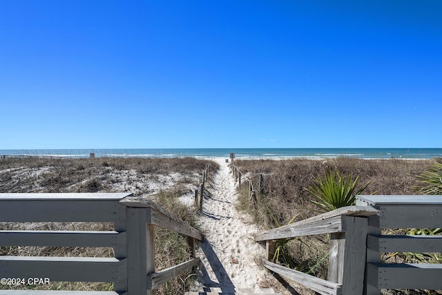 property view of water featuring a beach view