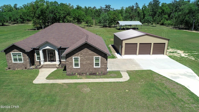 craftsman house with a front yard, a garage, and an outdoor structure