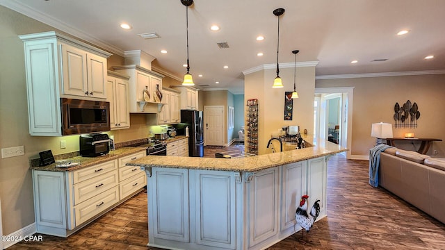 kitchen featuring ornamental molding, stainless steel microwave, electric range, decorative light fixtures, and fridge