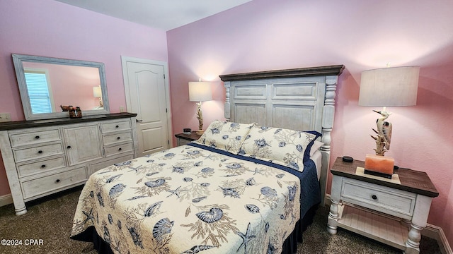 bedroom with dark colored carpet