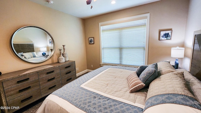 carpeted bedroom featuring ceiling fan