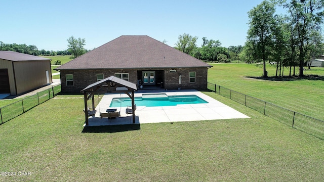 view of swimming pool featuring a yard and a patio