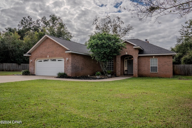 ranch-style house featuring a garage and a front lawn