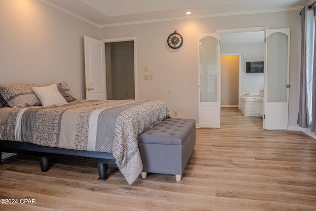 bedroom featuring light hardwood / wood-style flooring and ornamental molding