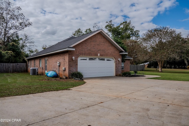 view of property exterior with a lawn and central air condition unit