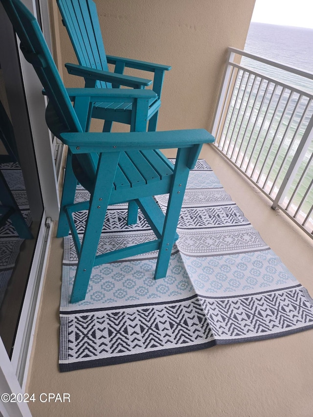 balcony featuring a water view