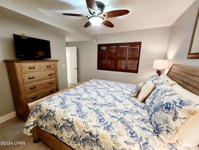 bedroom featuring ceiling fan and light hardwood / wood-style floors