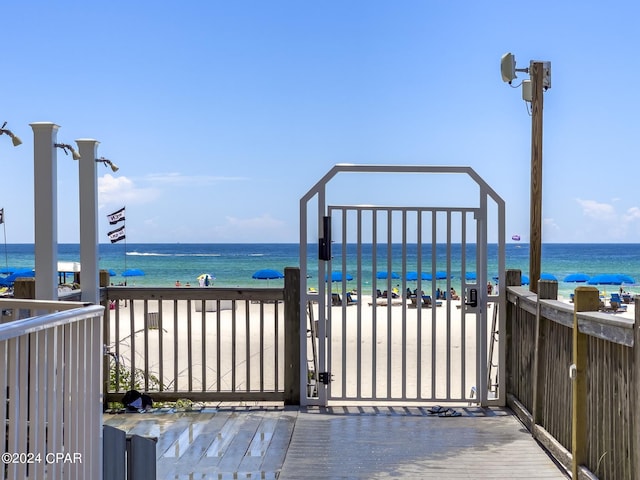 exterior space featuring a beach view and a water view