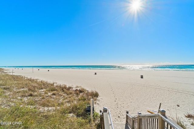 property view of water featuring a beach view