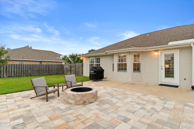 view of patio / terrace with a fire pit and grilling area