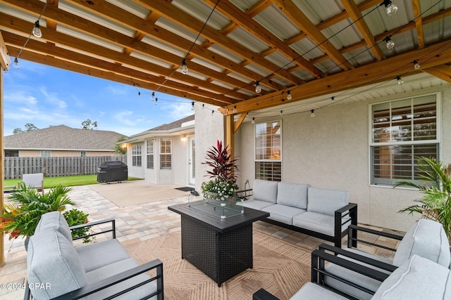 view of patio with outdoor lounge area and a grill