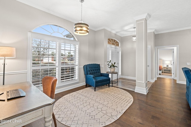 office space featuring dark hardwood / wood-style flooring, ornate columns, crown molding, and an inviting chandelier