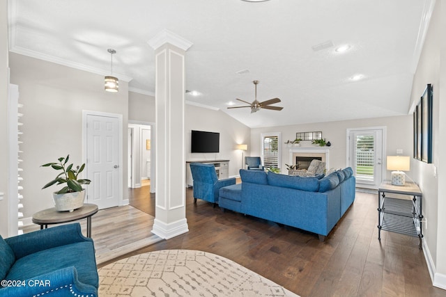 living room featuring decorative columns, crown molding, dark hardwood / wood-style flooring, and lofted ceiling