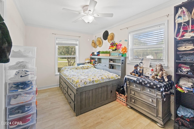 bedroom with light hardwood / wood-style flooring, multiple windows, ornamental molding, and ceiling fan