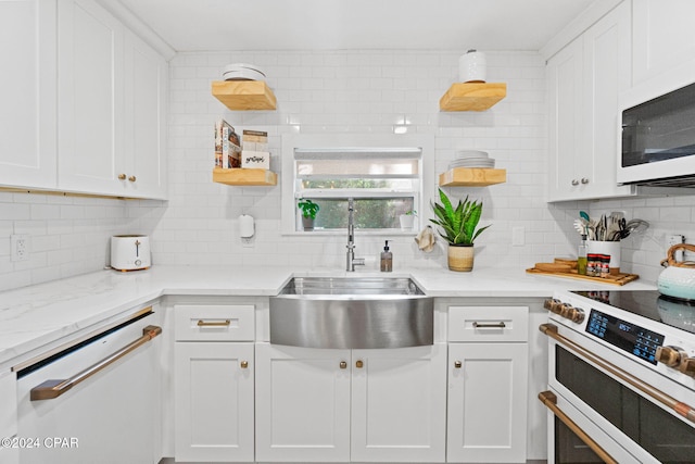 kitchen with white cabinets and white appliances