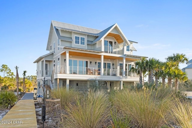 view of front of house with a balcony