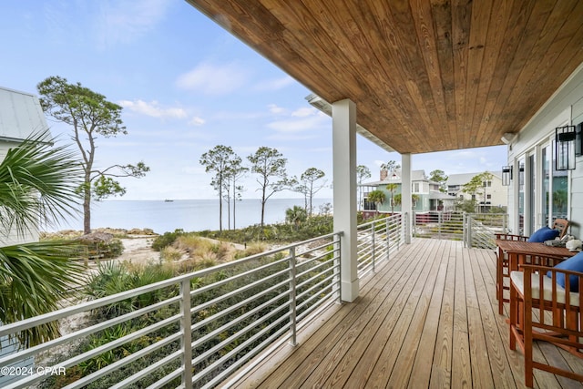 wooden deck with a water view