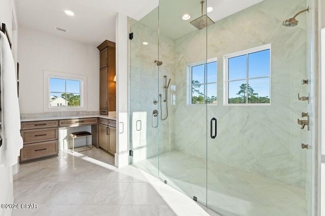 bathroom with a shower with door