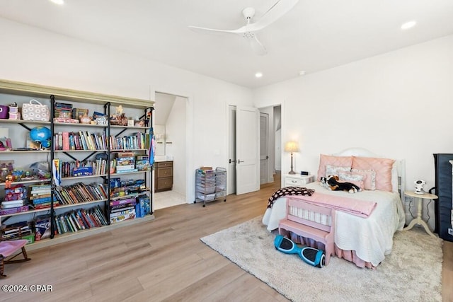 bedroom with light wood-type flooring and ceiling fan