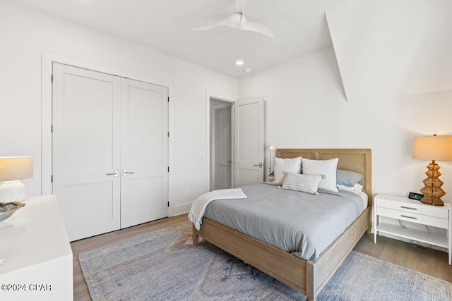 bedroom with hardwood / wood-style floors and ceiling fan