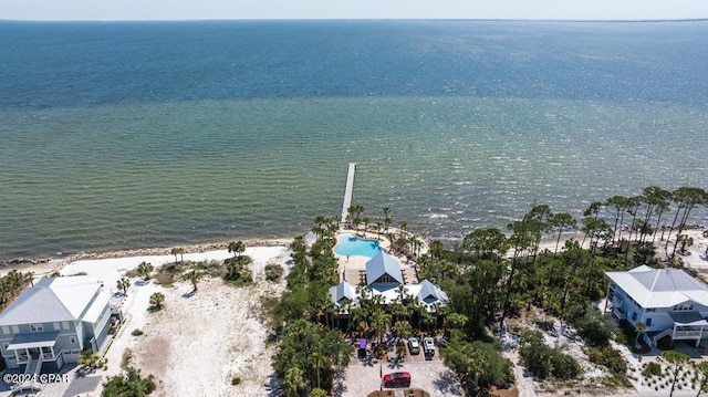 bird's eye view featuring a view of the beach and a water view