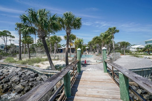 dock area with a community pool