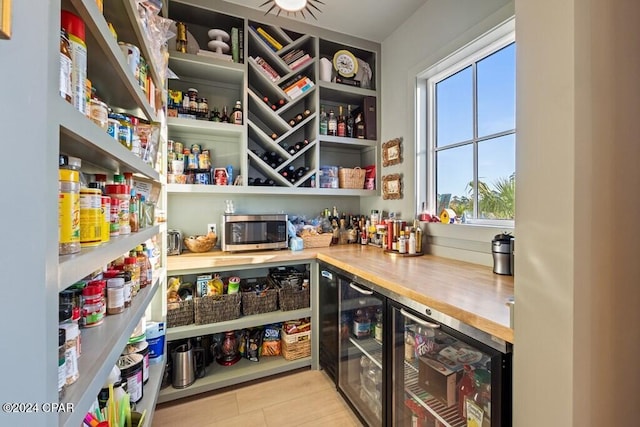 pantry featuring beverage cooler