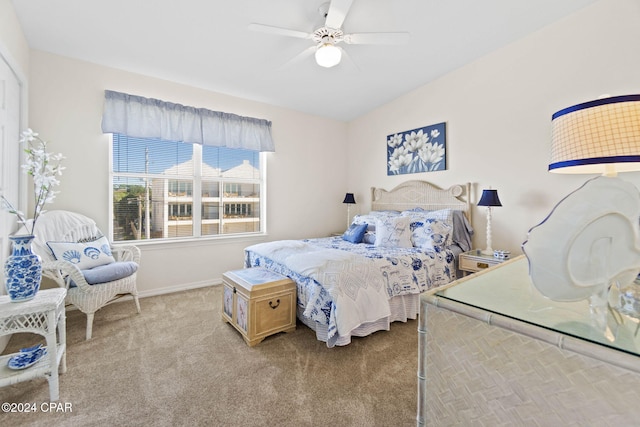 bedroom featuring ceiling fan and light carpet