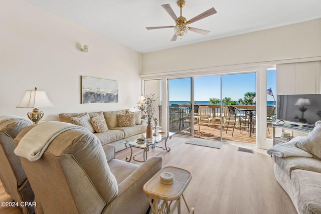 living room featuring hardwood / wood-style floors and ceiling fan