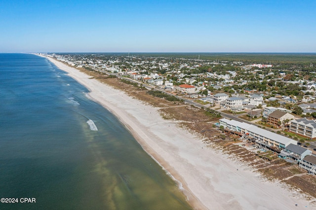 drone / aerial view featuring a view of the beach and a water view