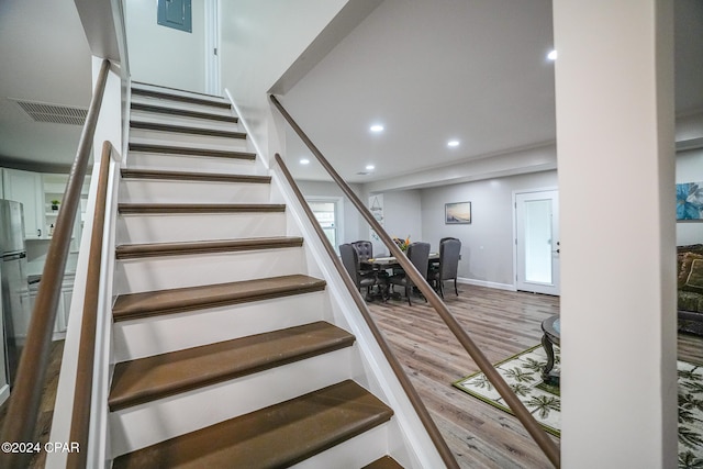 stairway featuring hardwood / wood-style floors