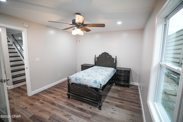 bedroom featuring ceiling fan and dark wood-type flooring