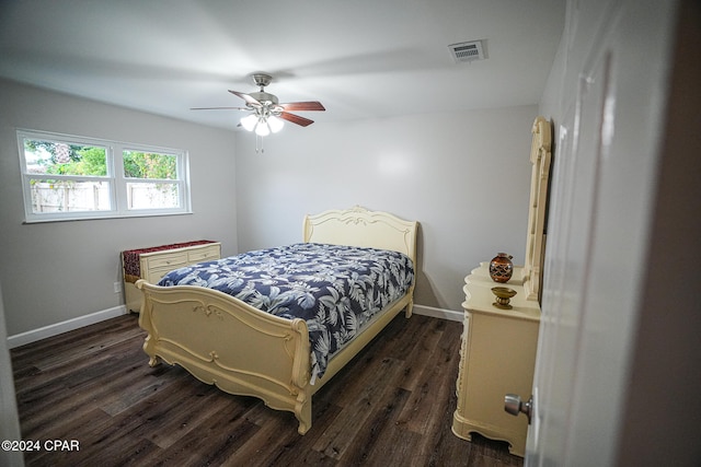 bedroom with ceiling fan and dark hardwood / wood-style flooring