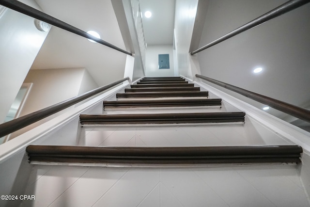 stairs with tile patterned floors