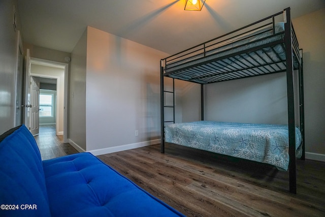 bedroom featuring dark hardwood / wood-style flooring