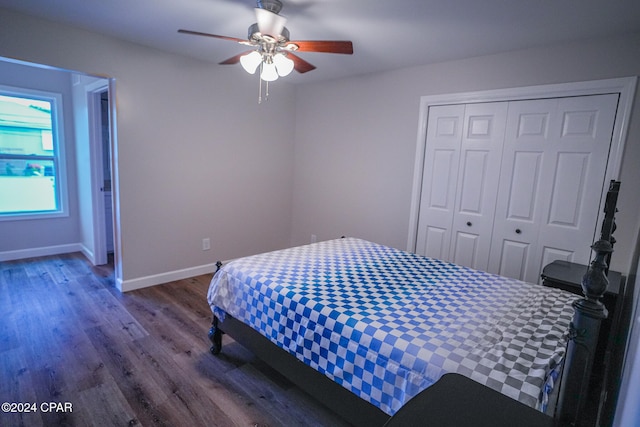 bedroom with ceiling fan, a closet, and wood-type flooring