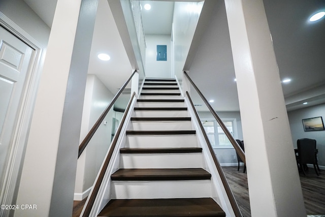 stairs with hardwood / wood-style flooring